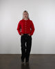 Strickjacke mit Rundhalsausschnitt im Laufen
